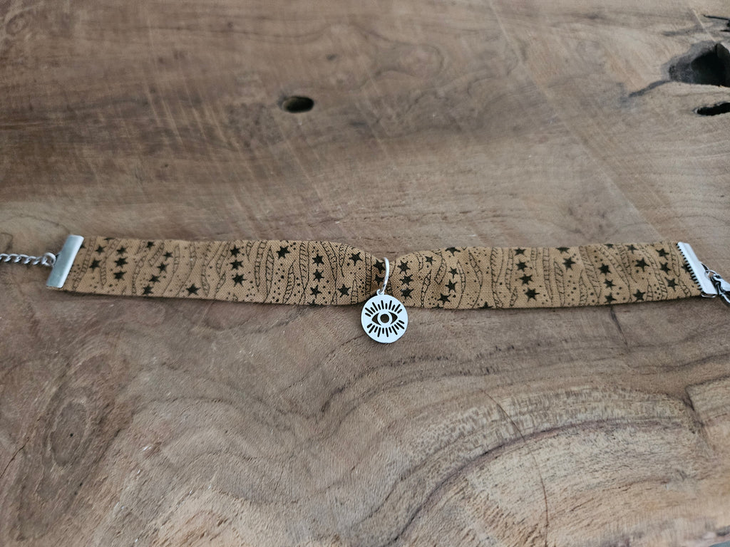 Bracelet tissu marron avec breloque oeil
